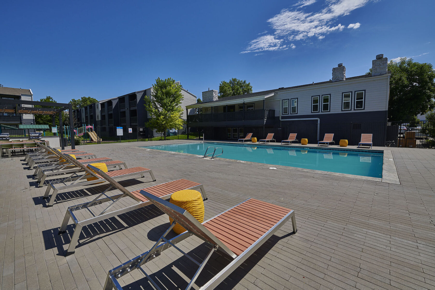 pool with deck seating and grills