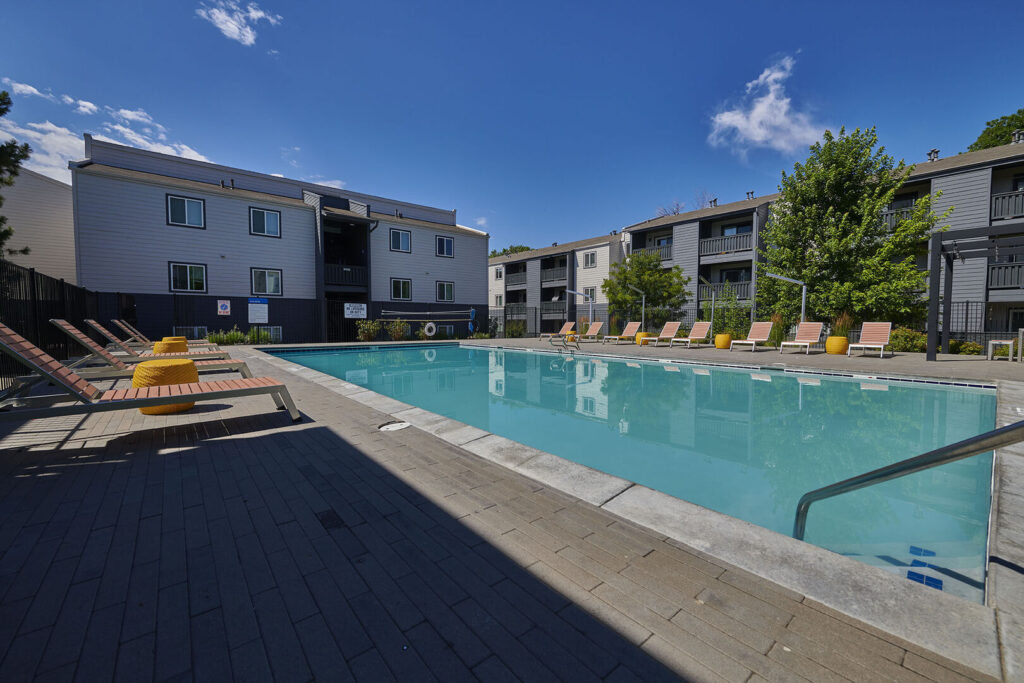 pool with deck seating and grills