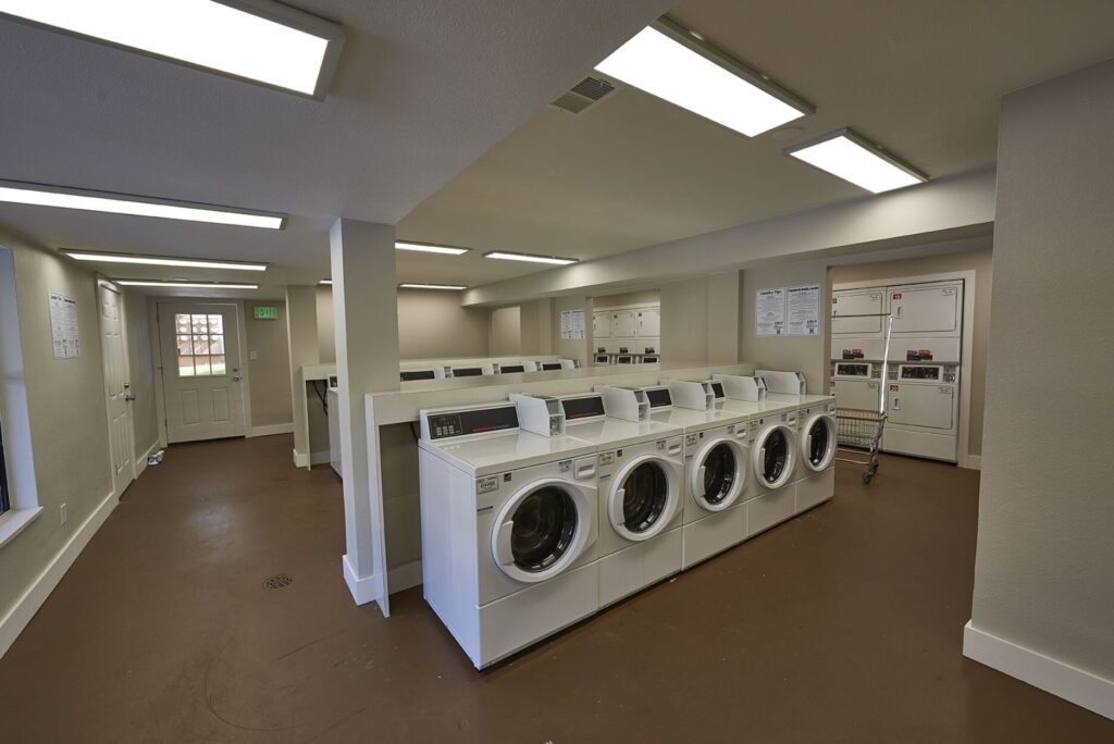 laundry facilities with lots of washers and dryers