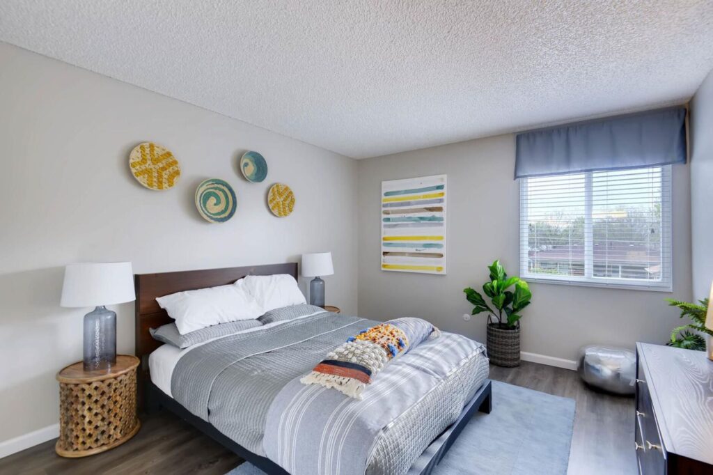 Spacious bedroom with window at Park Place at 92nd Apartments in Westminster, CO