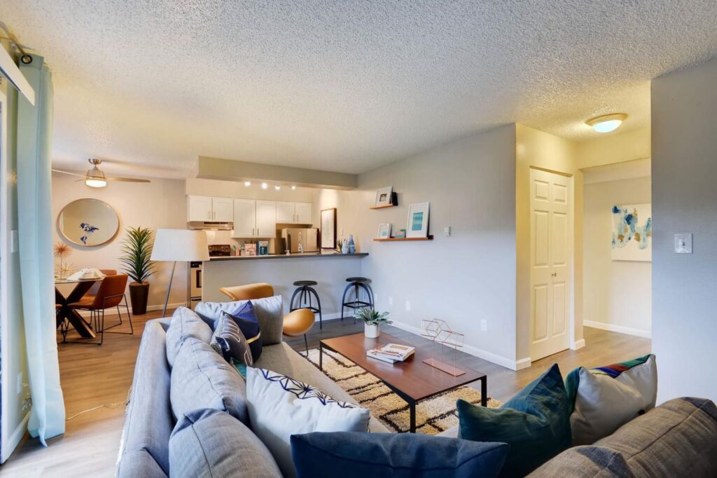Living room with view of kitchen and dining area