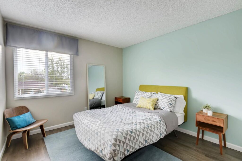 Bedroom with sea foam green accent wall